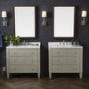 Wall-mounted double vanity with six dark drawers, gold knobs, and a white marble countertop featuring two sinks and gold faucets.