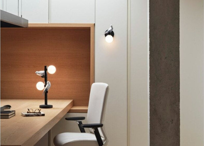 Modern office setup with a desk, chair, and decorative elements.