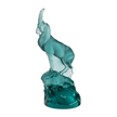 A frosted lalique cristal terramineral sculpture depicting a goat-like creature with an elegant horn, perched on a textured blue base.
