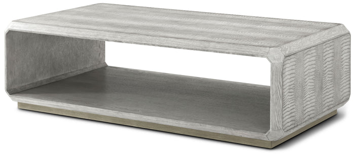 Rectangular luxury coffee table with a gray finish, featuring an open shelf and textured sides for a modern aesthetic.