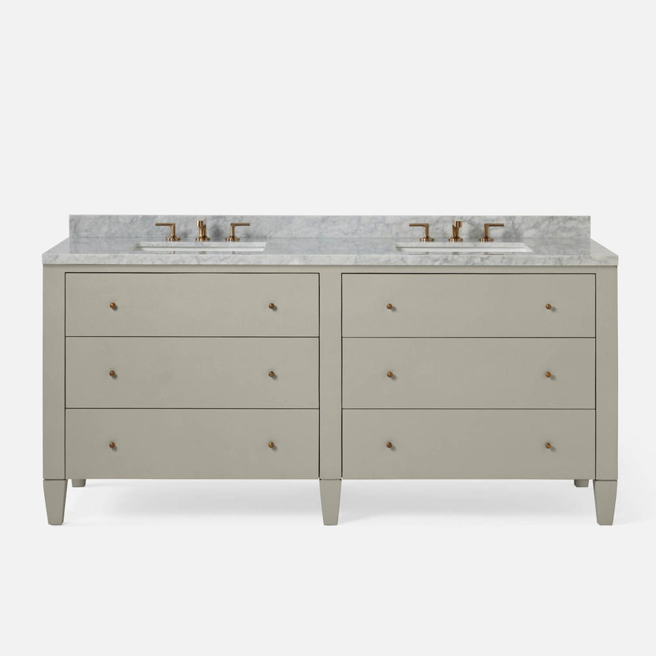A stylish double vanity featuring a light gray finish, marble countertop, and brass faucets, with four spacious drawers on each side.