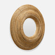A large, roundshaped mirror with a textured bamboo frame, showcasing a natural, earthy aesthetic.