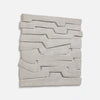 Gray abstract wall art featuring layered, wavy forms creating an intriguing, textured design.